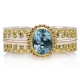 RS-12152 handgemaakte ring uit zilver en goud met blauwe ovaal topaas